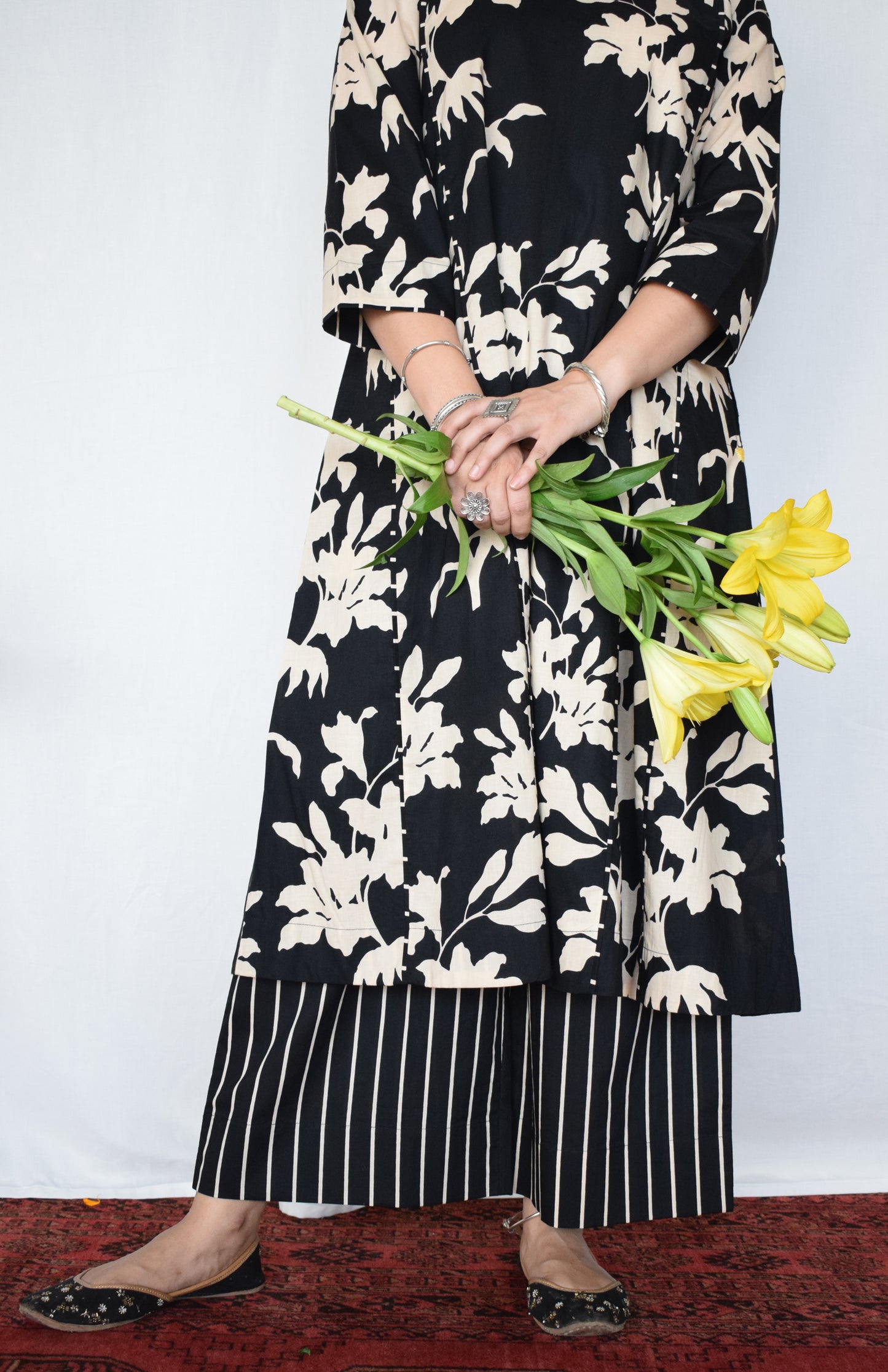 Black floral kurta set with striped pajama