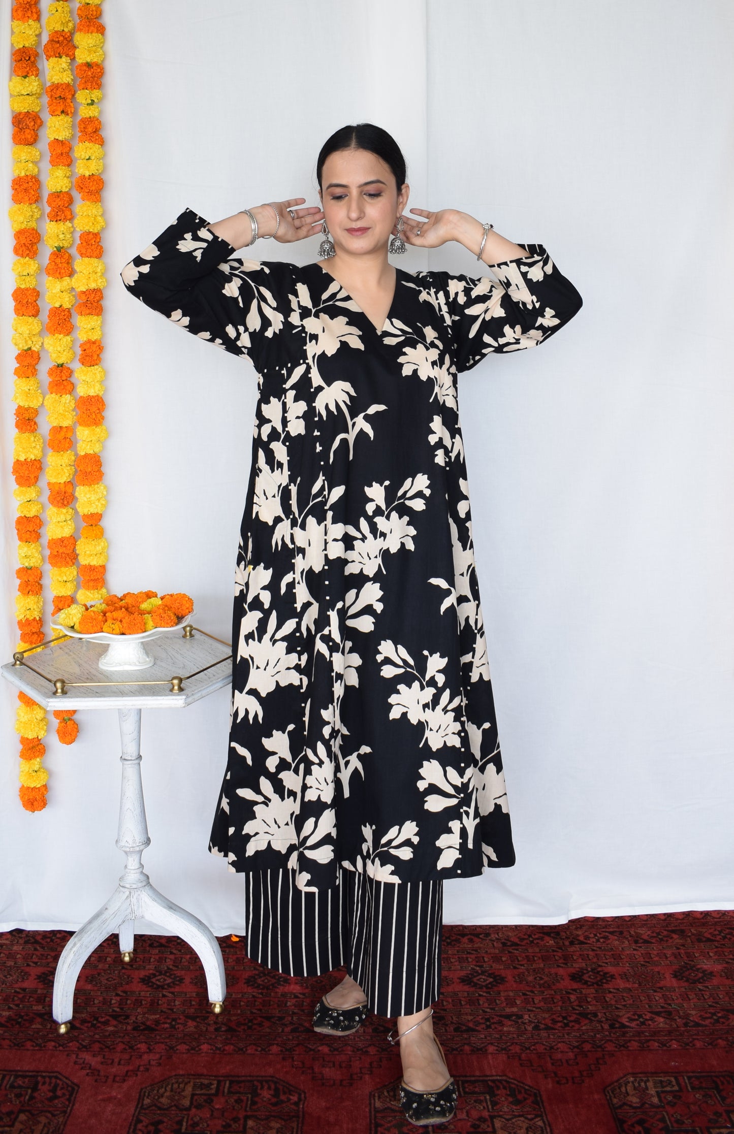 Black floral kurta set with striped pajama