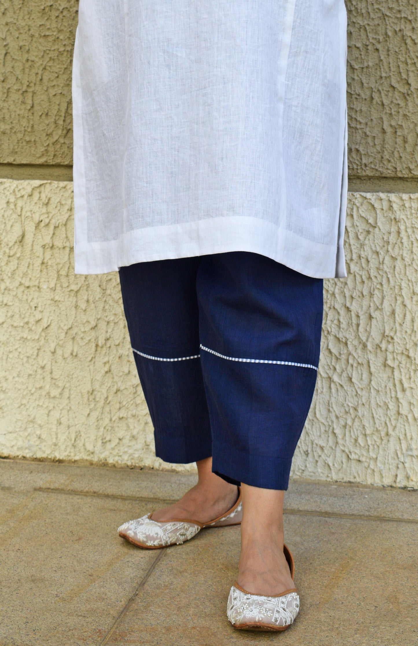 White linen straight fit paneled kurta set with dark blue trousers
