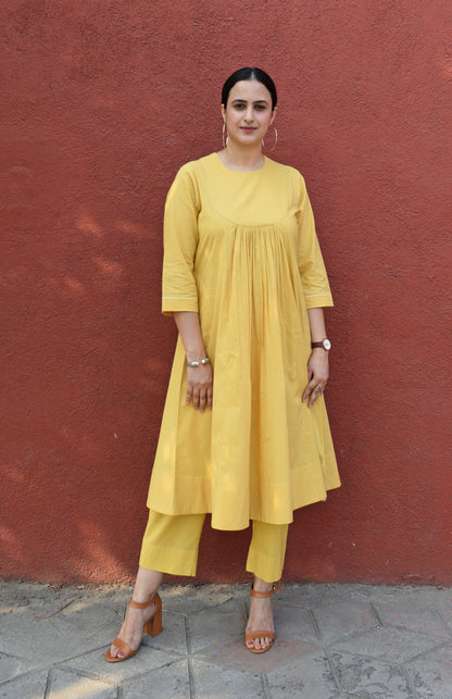 Yellow kurta set with yoke and pyjama